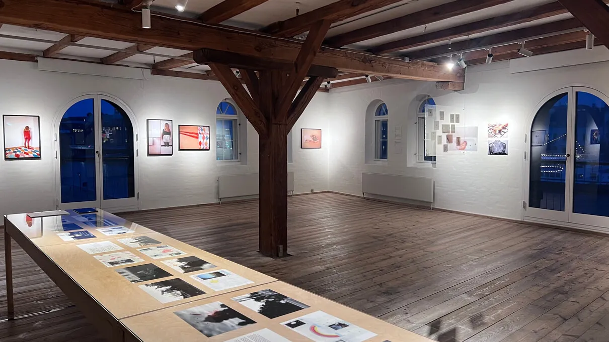 Exhibition hall with works on the walls